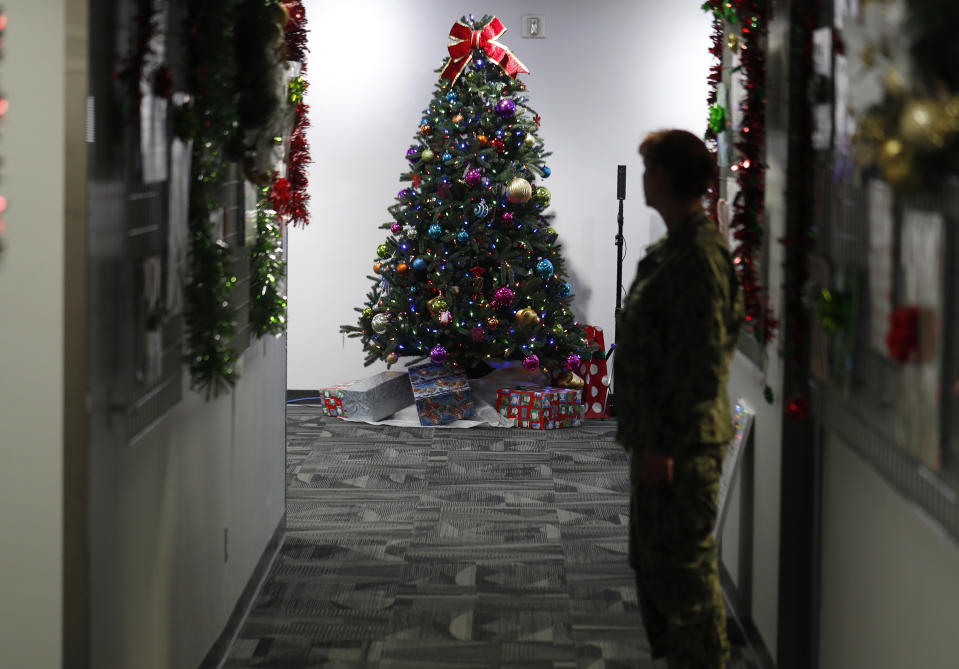 A decorated tree stands in the NORAD Tracks Santa Center at Peterson Air Force Base, Monday, Dec. 23, 2019, in Colorado Springs, Colo. More than 1,500 volunteers will handle an estimated 140,000 telephone inquiries from around the globe from children and their parents on the whereabouts of Santa Claus on Christmas Eve. (AP Photo/David Zalubowski)