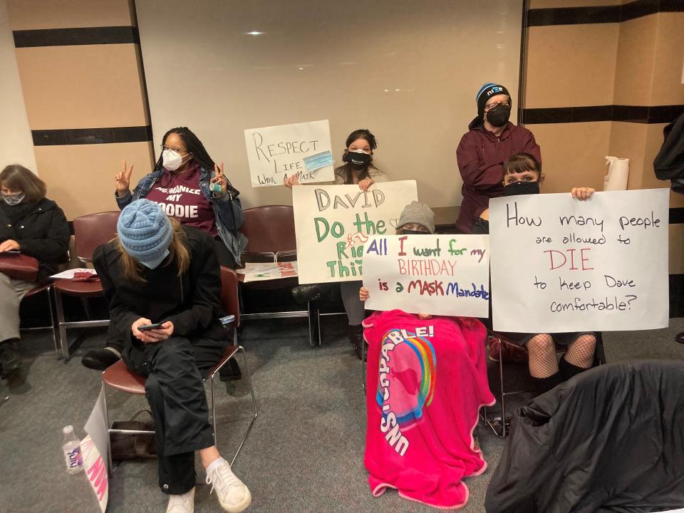 Some residents held handmade signs a St. Cloud City Council meeting Monday, Jan. 24, 2022, as city officials discussed a city mask mandate.