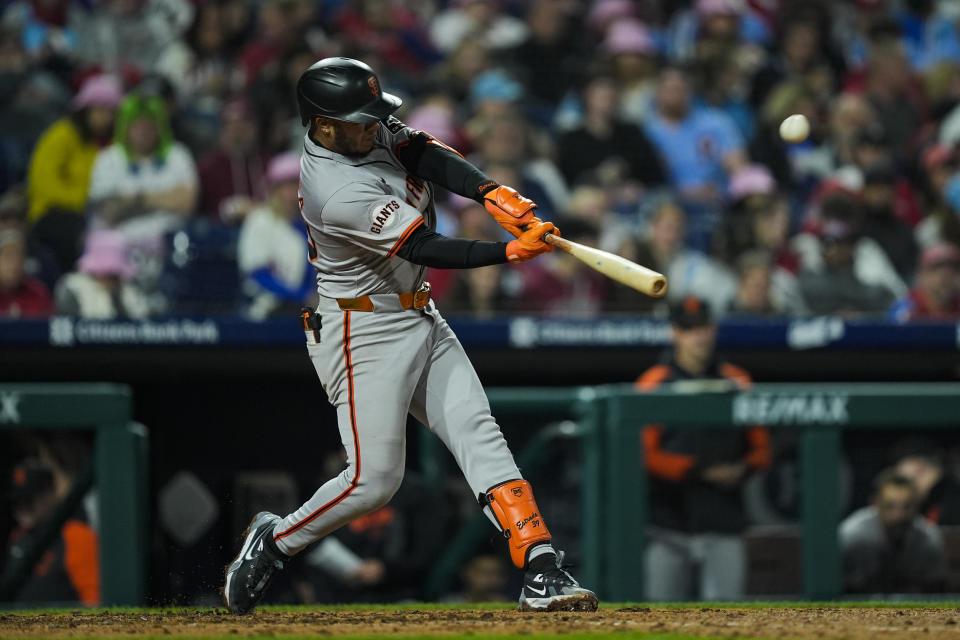 San Francisco Giants' Thairo Estrada hits a two-run home run off Philadelphia Phillies pitcher Taijuan Walker during the seventh inning of a baseball game, Sunday, May 5, 2024, in Philadelphia. (AP Photo/Matt Rourke)