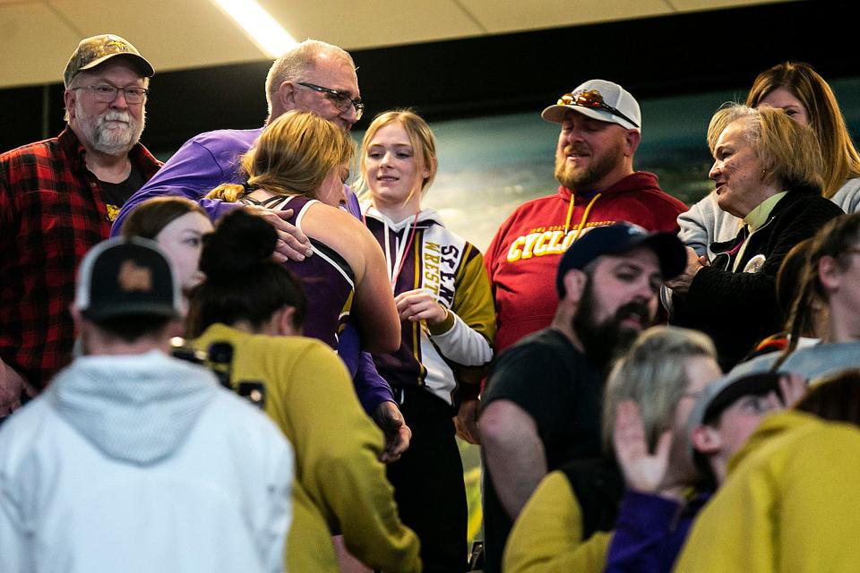 Spencer's Olivia Huckfelt celebrates after her match at 235 pounds in the finals during the IGHSAU state girls wrestling tournament, Friday, Feb. 3, 2023, at the Xtream Arena in Coralville, Iowa.