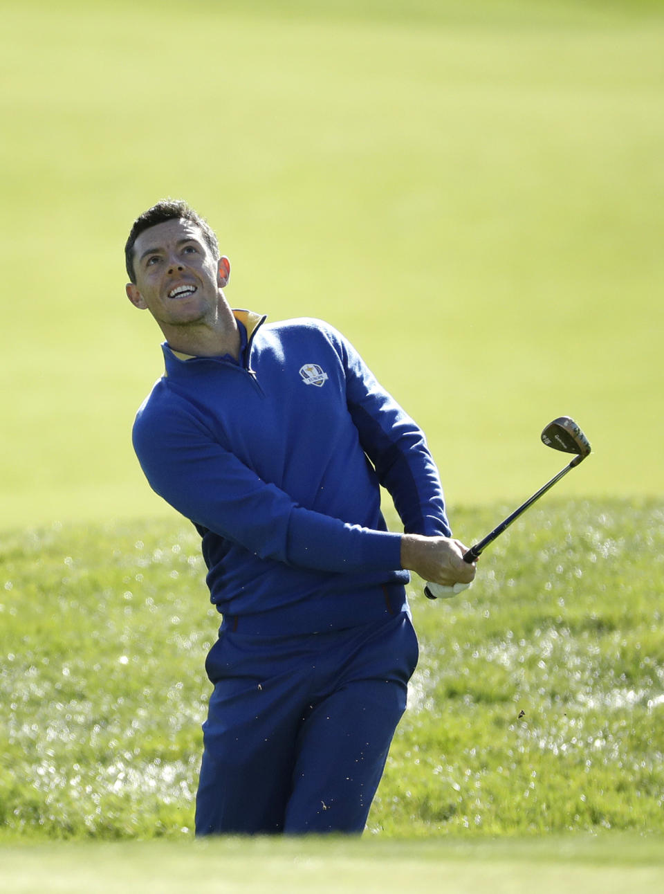 Europe's Rory McIlroy chips on to the 5th green during a singles match on the final day of the 42nd Ryder Cup at Le Golf National in Saint-Quentin-en-Yvelines, outside Paris, France, Sunday, Sept. 30, 2018. (AP Photo/Matt Dunham)