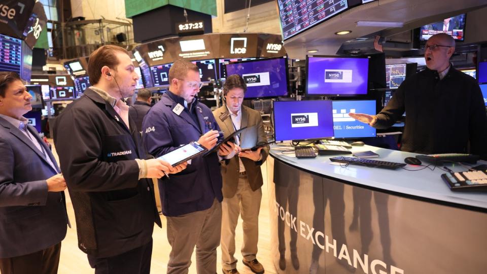 Traders work on the floor of the New York Stock Exchange