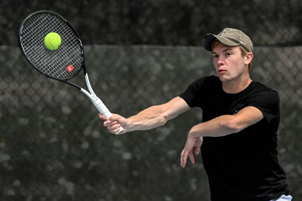Sioux Falls Lincoln's Gage Gohl returns a volley in flight 1 singles action during day one of the Class AA state tournament on Thursday at Sioux Park in Rapid City.