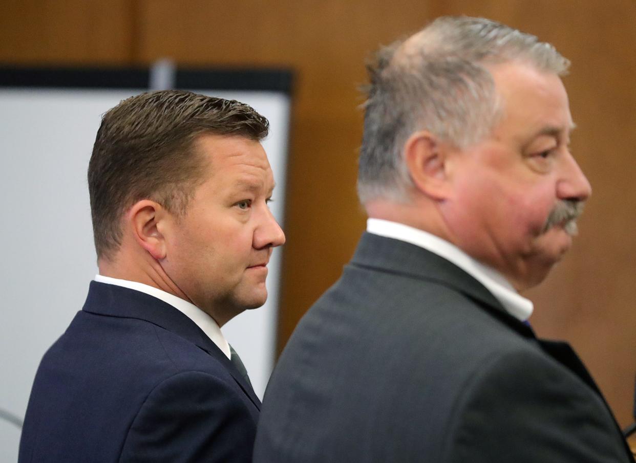 Rep. Bob Young, left, and his attorney John Greven listen as Judge Edward O’Farrell speaks during his arraignment hearing on Aug. 4.