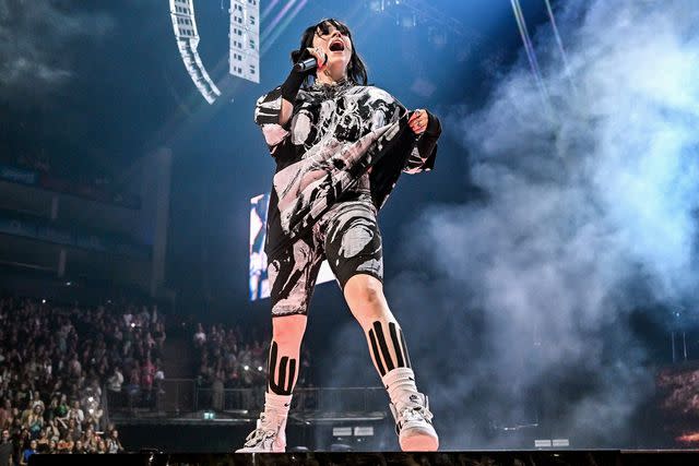 <p>Samir Hussein/Getty</p> Billie Eilish performs on stage during her Happier Than Ever World Tour, at The O2 Arena on June 10, 2022.