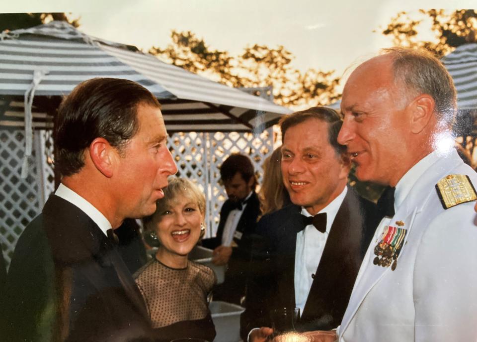 Prince Charles talks with then-Newport Mayor David Gordon, and Admiral James Stark, president of the Naval War College during Charles's visit in 1996.