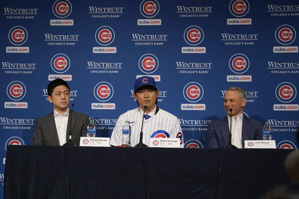 New Chicago Cubs pitcher Shōta Imanaga takes part in a news conference along with interpreter Shingo Murata, left, and Cubs president of baseball operations Jed Hoyer, right, Friday, Jan. 12, 2024, in Chicago. The Japanese left-hander is expected to step right into the baseball team's rotation as it tries to return to the playoffs for the first time since 2020. (AP Photo/Nam Y. Huh)