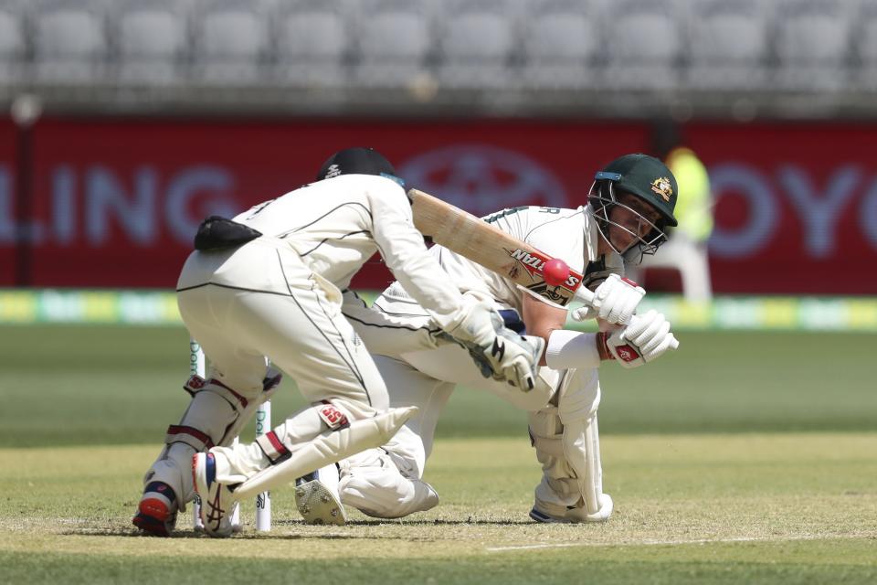 Australia's David Warner bats as New Zealand's BJ Watling looks on during play in their cricket test in Perth, Australia, Thursday, Dec. 12, 2019. (AP Photo/Trevor Collens)