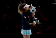 Tennis - Australian Open - Women's Singles Final - Melbourne Park, Melbourne, Australia, January 26, 2019. Japan's Naomi Osaka kisses the trophy after winning her match against Czech Republic's Petra Kvitova. REUTERS/Aly Song