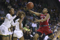 Texas Tech guard Chrislyn Carr, right, shoots over Baylor guard Juicy Landrum, left, in the first half of an NCAA college basketball game, Saturday, Jan. 25, 2020, in Waco Texas. Baylor won 87-79. (AP Photo/Rod Aydelotte)