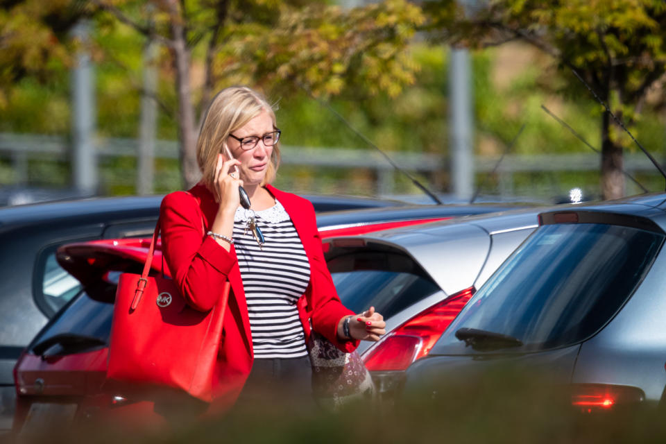 People leaving the Thomas Cook HQ in Peterborough, Cambs.  September 23, 2019.  Photo: SWNS