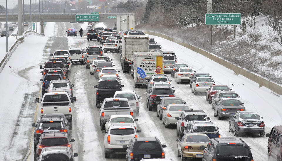 The westbound Interstate 696 is closed at Groesbeck Highway due to numerous accidents, Sunday, Jan. 26, 2014, on I-696 in Roseville, Mich. (AP Photo/Detroit News, Robin Buckson) DETROIT FREE PRESS OUT; HUFFINGTON POST OUT.