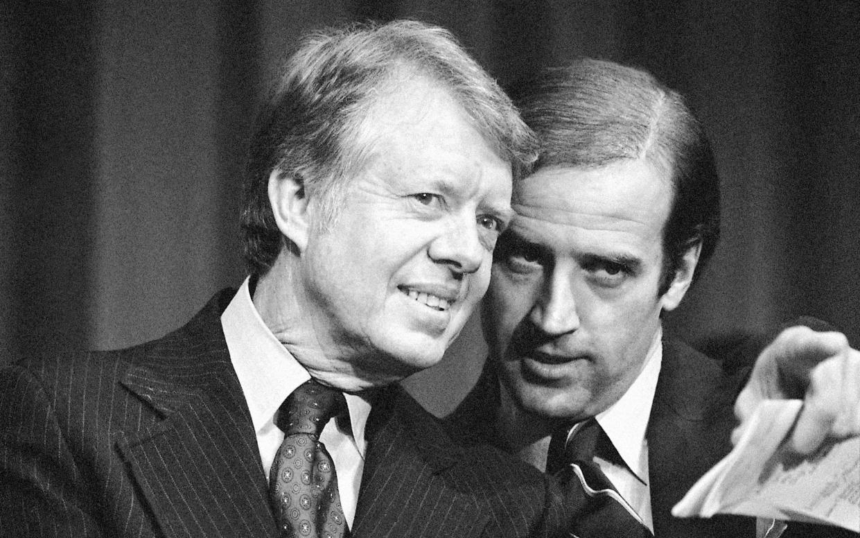 President Jimmy Carter listens to Sen. Joseph R. Biden, - Barry Thumma/AP