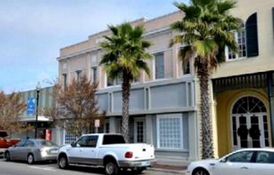 The Anderson Theater building in downtown Gulfport is pictured before a $2.4 million restoration project combined it with the original Balch & Bingham law office to the right.