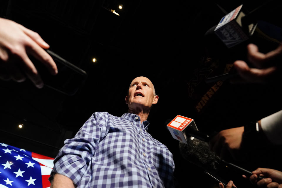 Sen. Rick Scott, R-Fla., speaks to the media after a campaign rally for Republican candidates for U.S. Senate Sen. Kelly Loeffler and Sen. David Perdue on Friday, Nov. 13, 2020, in Cumming, Ga. (AP Photo/Brynn Anderson)