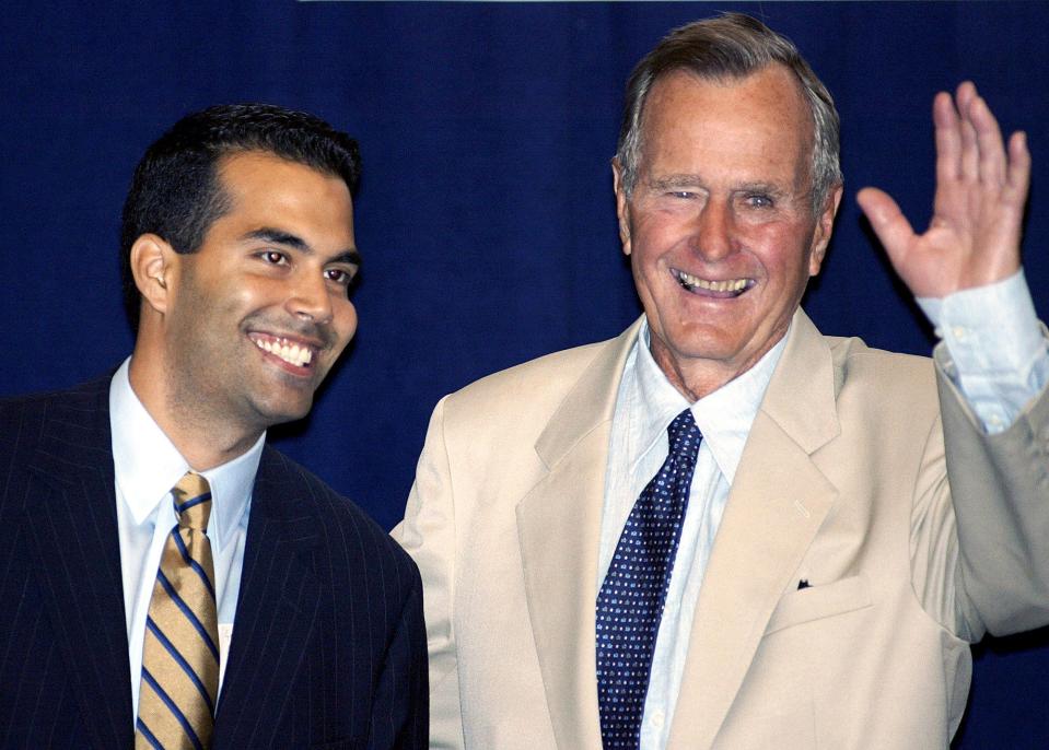 In this Aug. 31, 2004 file photo George P. Bush, left, stands with his grandfather, former President George H.W. Bush, in New York prior to their remarks at a reception hosted by the Hispanic Alliance for Progress Institute in conjunction with the Republican National Convention.