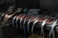 In this Sept. 1, 2019 photo, fish are displayed for customers inside the Ver-o-Peso riverside market in Belém, Brazil. The Ver-o-Peso market includes docks, the acai fair, a meat market and a fish market. (AP Photo/Rodrigo Abd)