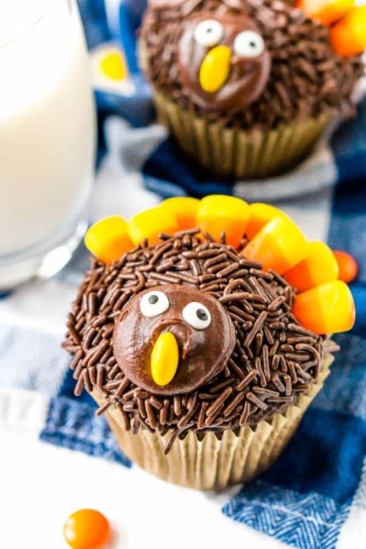<p>Sugar and Soul</p><p> Roll the top of the cupcakes in sprinkles, add candy corn “feathers,” then attach a cookie head and candy faces.</p><p><strong>Get the recipe: </strong><a href="https://www.sugarandsoul.co/turkey-cupcakes/" rel="nofollow noopener" target="_blank" data-ylk="slk:Turkey Cupcakes;elm:context_link;itc:0;sec:content-canvas" class="link "><strong>Turkey Cupcakes</strong></a></p>