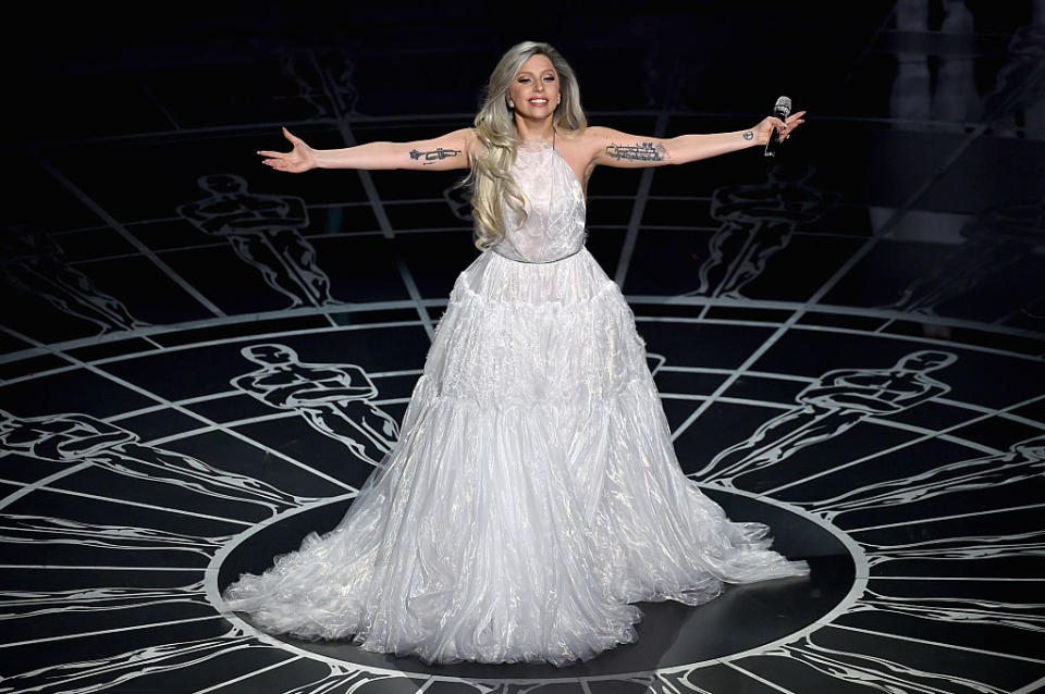 A silver-haired Lady Gaga performs at the Oscars in 2015.