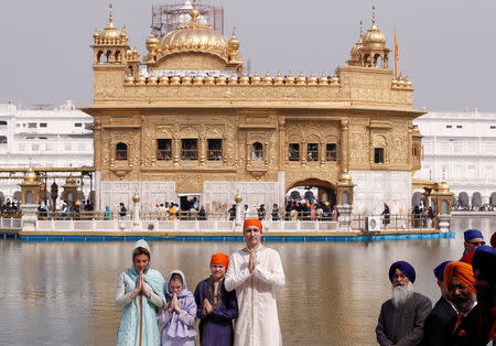 Canadian Prime Minister Justin Trudeau, his wife Sophie Gregoire, daughter Ella Grace and son Xavier pose for photographers during their visit to the holy Sikh shrine of Golden temple in Amritsar, India February 21, 2018. REUTERS/Adnan Abidi