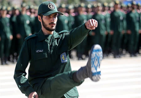 An Iranian Officer of Revolutionary Guards, with Israel flag drawn on his boots, is seen during graduation ceremony, held for the military cadets in a military academy, in Tehran, Iran June 30, 2018. Tasnim News Agency/via REUTERS/Files