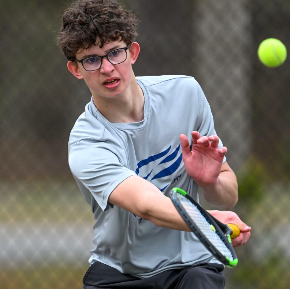 Cape Cod Academy number three singles player Connor Hall returns a shot against Sturgis boys tennis.