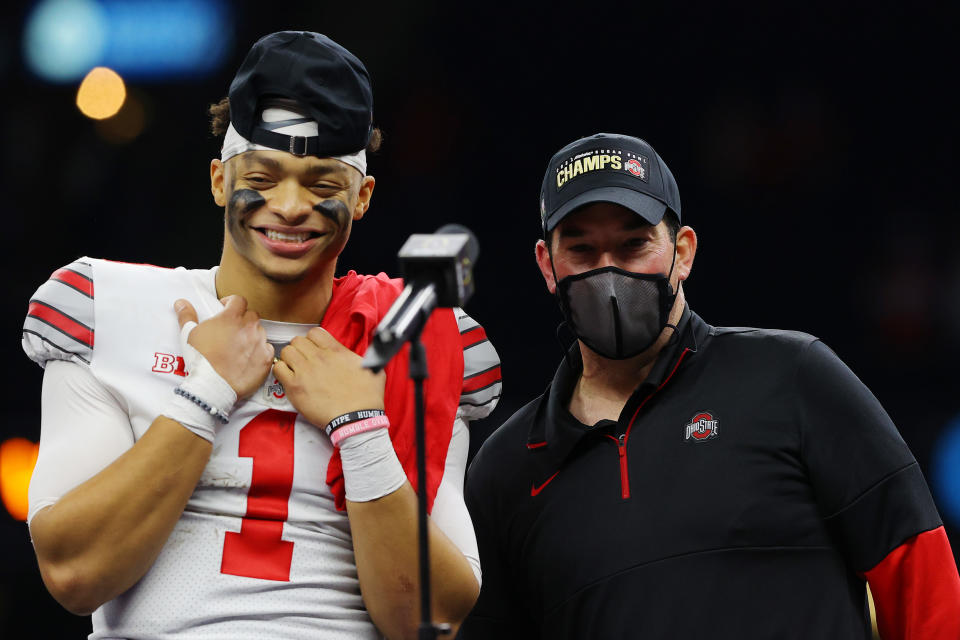 Justin Fields and Ryan Day of the Ohio State Buckeyes react after defeating Clemson, 49-28, in the College Football Playoff semifinal on Jan. 1. (Kevin C. Cox/Getty Images)