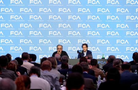 Fiat Chrysler Automobiles CEO Sergio Marchionne attends next to chairman John Elkann during media conference in Balocco, northern Italy, June 1, 2018. REUTERS/Massimo Pinca