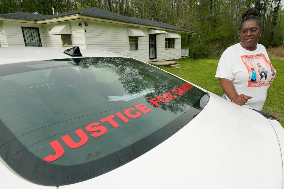 Monica Lee stands outside her eldest son's house in Braxton, Miss., Tuesday, March 21, 2023, as she talks about her youngest son, Damien Cameron. The 29-year-old Black man, with a history of mental illness, died in July 2021 after being arrested by two Rankin County sheriff's deputies. An Associated Press investigation found that deputies from a special unit of that sheriff's department are being investigated by the U.S. Justice Department for their role in another incident where they may have committed civil rights violations.