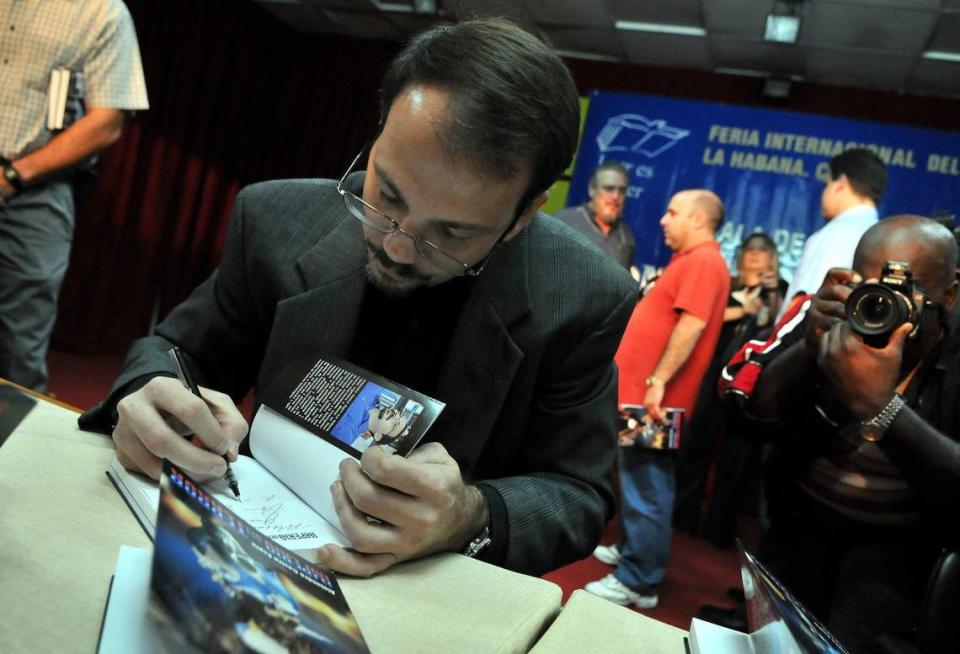 Col. Alejandro Castro Espín, son of Raúl Castro and nephew of Fidel Castro, signs a copy of his book “Imperio del Terror,” on Feb. 21, 2009 during the Havana’s International Book Festival in Cuba. EFE/Alejandro Ernesto