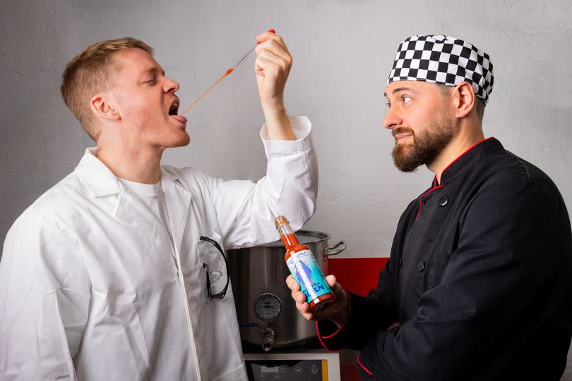 The sauce being tested by two men