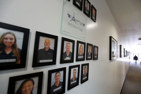 Portraits of flight instructors hand on the wall at Coast Flight Training in San Diego, California, U.S., January 15, 2019. REUTERS/Mike Blake/Files