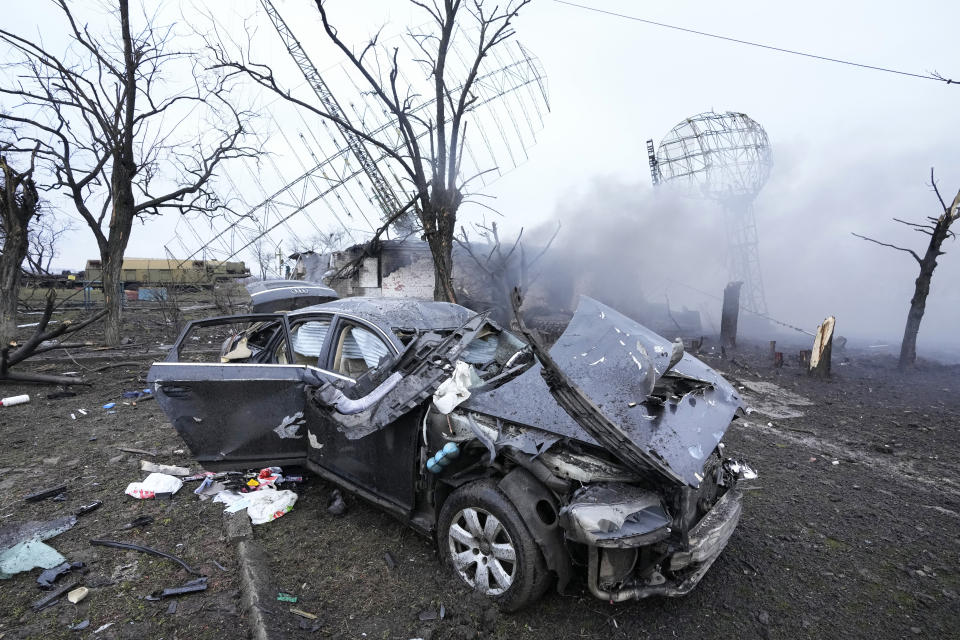 FILE - Damaged radar, a vehicle and equipment are seen at a Ukrainian military facility outside Mariupol, Ukraine on Feb. 24, 2022. Since Russia invaded Ukraine in February 2022, more than 45,000 Ukrainians have sought refuge in Israel. Then, Israel's war erupted. Now many are reliving their trauma. Some have left Israel, but many remain — refusing to again flee a war. (AP Photo/Sergei Grits, File)