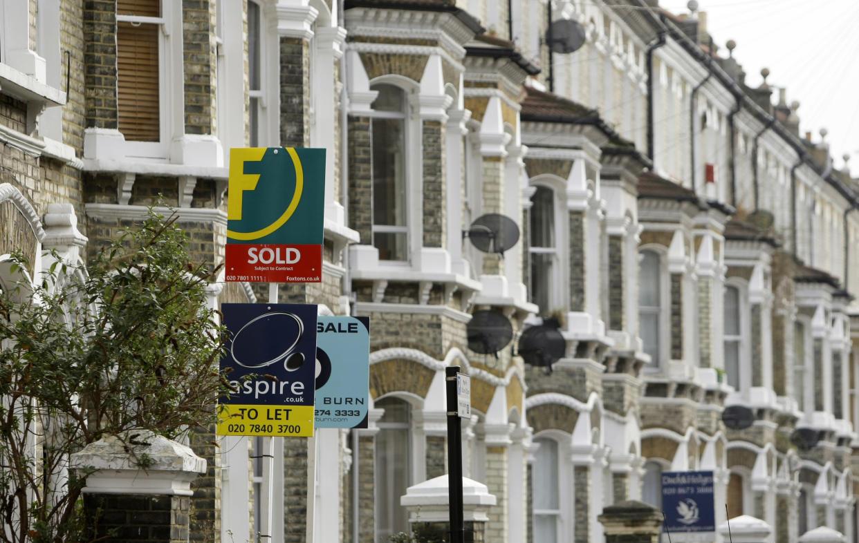 Estate agents' boards are seen in south London, Tuesday Feb. 17, 2009. British homeowners are returning to the property market looking to pick up bargains following recent house price falls, research showed Tuesday. (AP Photo/Matt Dunham)