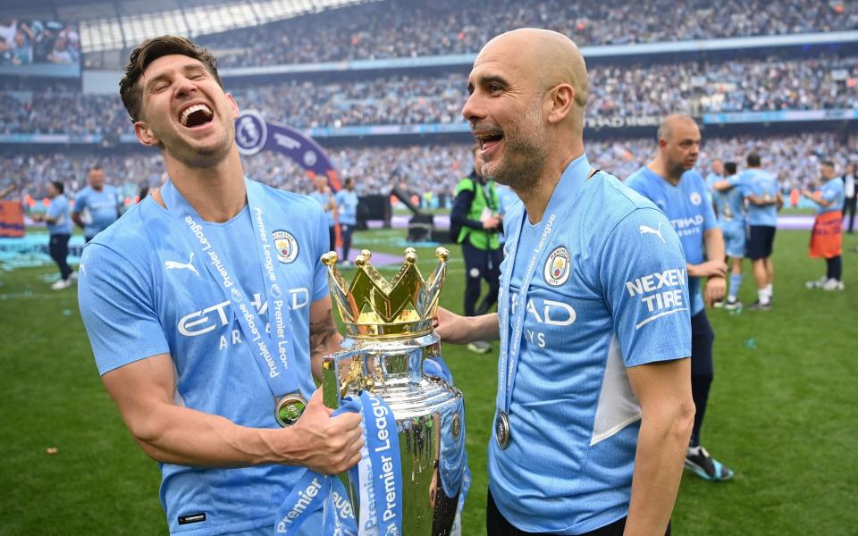 John Stones and Pep Guardiola - Michael Regan/Getty Images