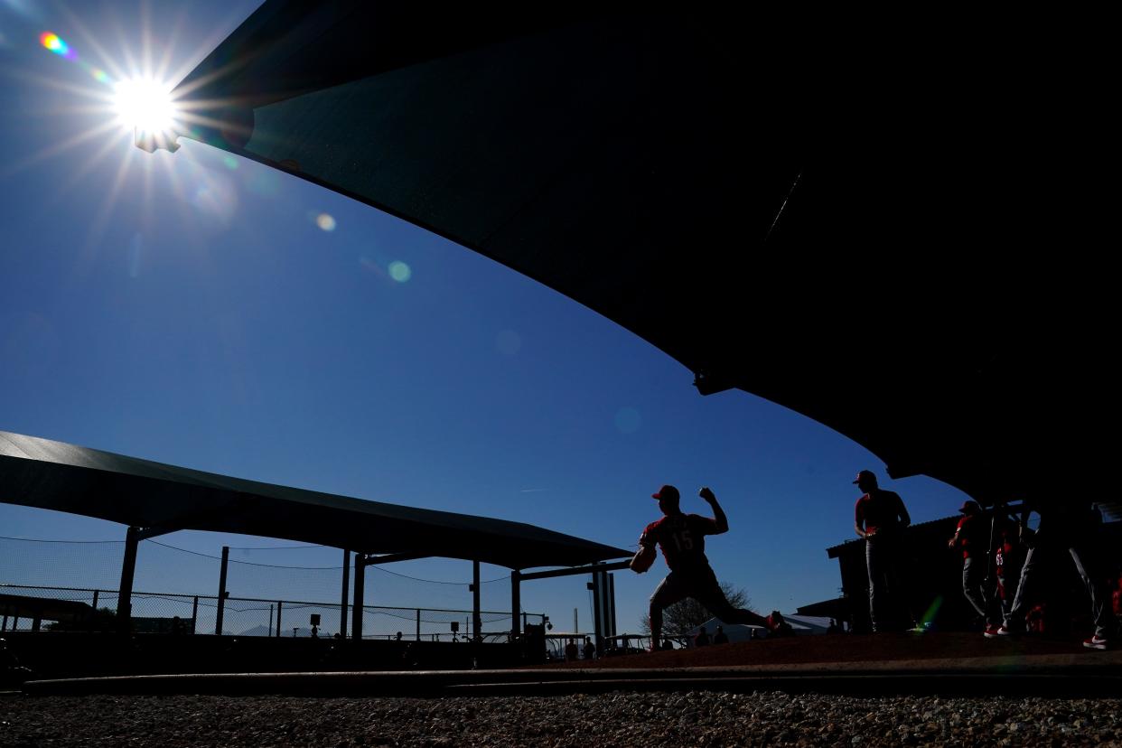 Cincinnati Reds relief pitcher Emilio Pagan (15) delivers a pitch in the bullpen during spring training workouts, Wednesday, Feb. 14, 2024, at the team’s spring training facility in Goodyear, Ariz.