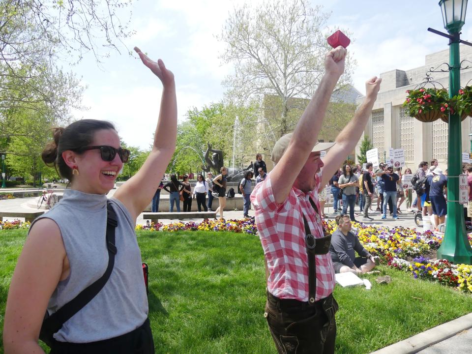 IU grad students Katharina Schmid-Schmidsfelden and Brian Hensley participate in the IGWC rally on Monday, May 9.