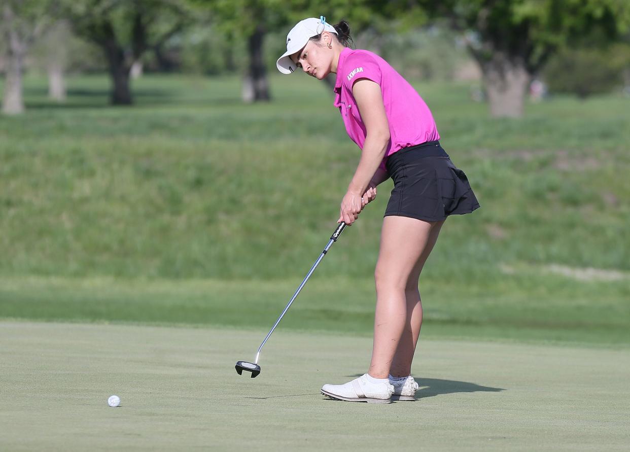 Olivia Axmear shot a 36 at the Gilbert girls golf quadrangular dual on Tuesday in Ames. That earned her medalist runner-up honors and tied a school record for the lowest 9-hole score in program history.