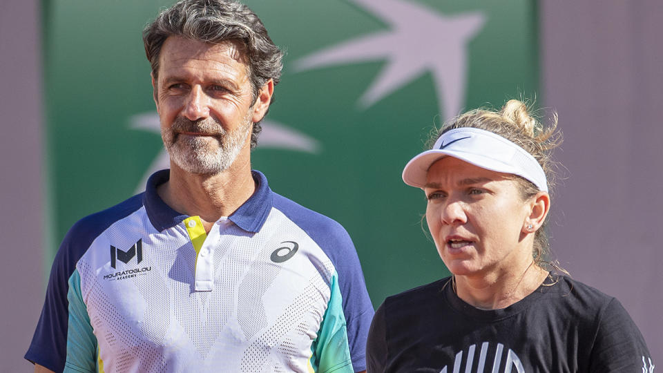 Patrick Mouratoglou and Simona Halep are pictured during a training session.