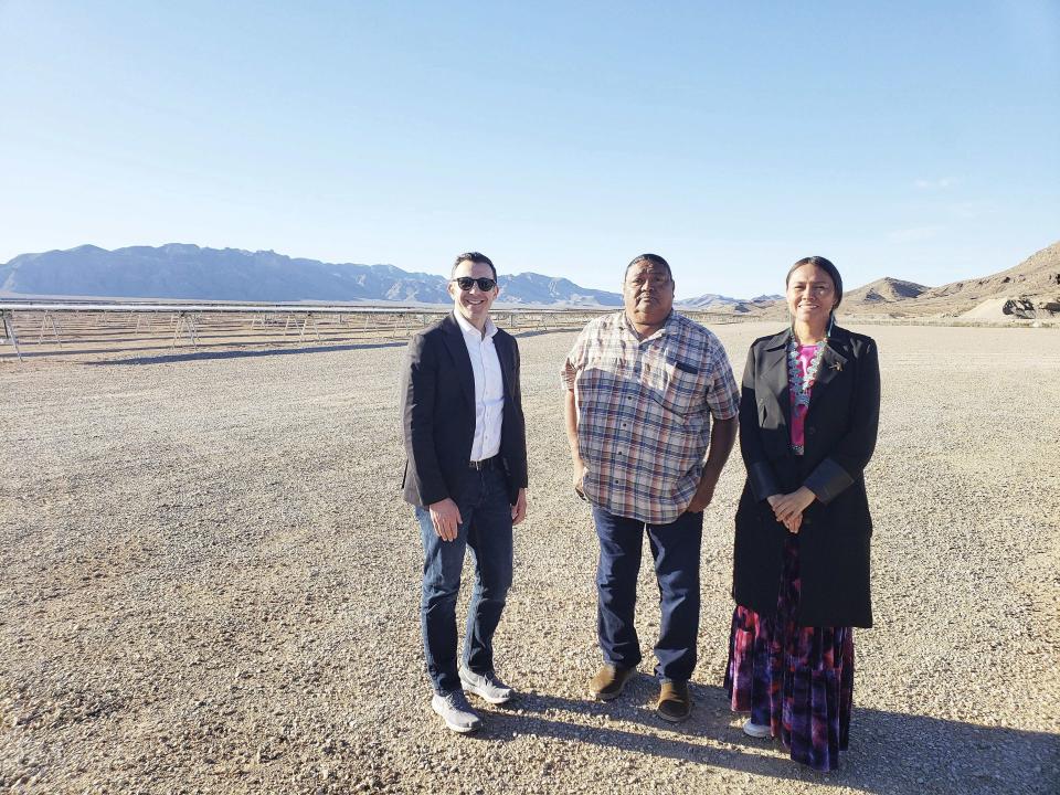 This April 6, 2023 image provided by the U.S. Department of Energy shows Wahleah Johns, right, director of the DOE Office of Indian Energy, and Jeff Marootian, left, a senior adviser to the secretary, posing with Moapa Band of Paiutes Chairman Gregory Anderson Sr., center, during a visit to a solar facility on the Moapa River Indian Reservation near Moapa, Nevada. (U.S. Department of Energy via AP)