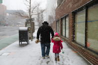 <p>A man walks his daughter to school in New York City as a winter storm moved into the area on Wednesday, March 21, 2018. (Photo: Gordon Donovan/Yahoo News) </p>