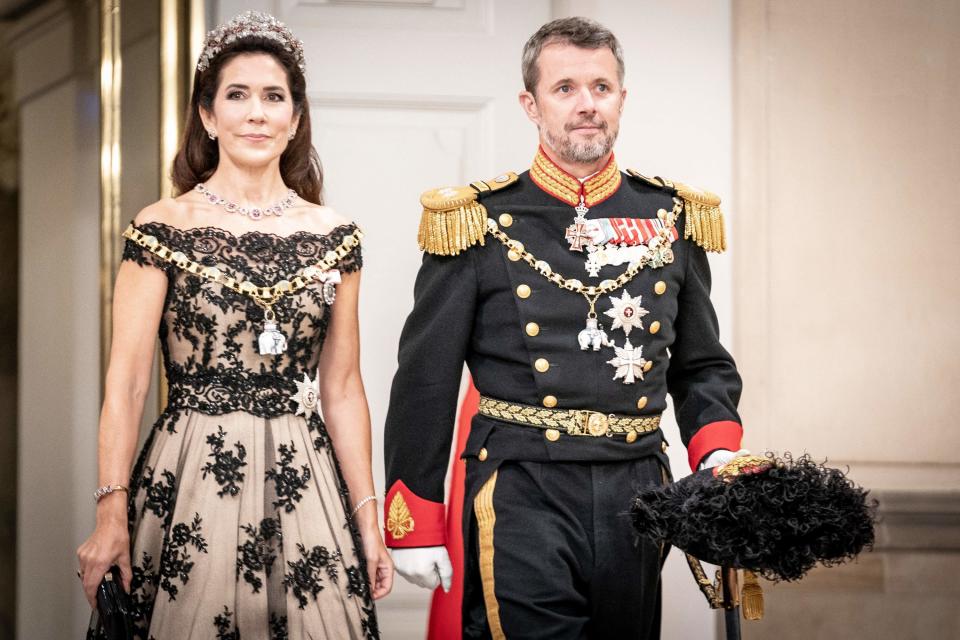 the crown prince and princess standing together in royal garb