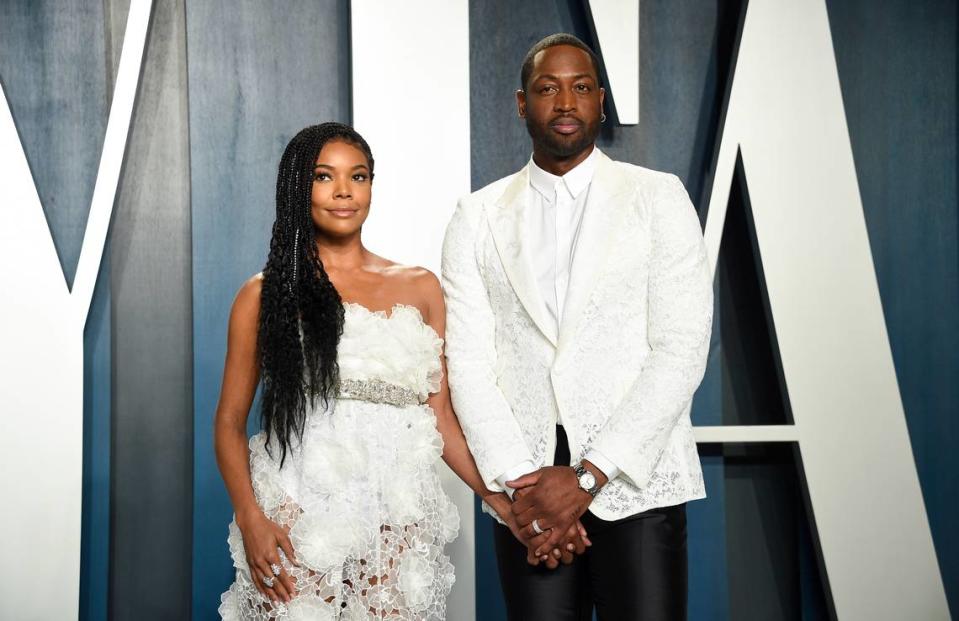 Gabrielle Union, left, and husband Dwyane Wade arrive at the Vanity Fair Oscar Party on Sunday, Feb. 9, 2020, in Beverly Hills, Calif. (Photo by Evan Agostini/Invision/AP)