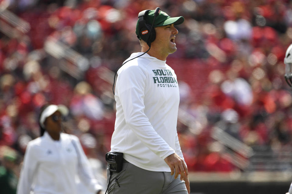 South Florida head coach Jeff Scott shouts at an official during the first half of an NCAA college football game against Louisville in Louisville, Ky., Saturday, Sept. 24, 2022. (AP Photo/Timothy D. Easley)