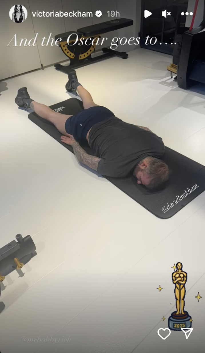 he's lying face down on a workout mat