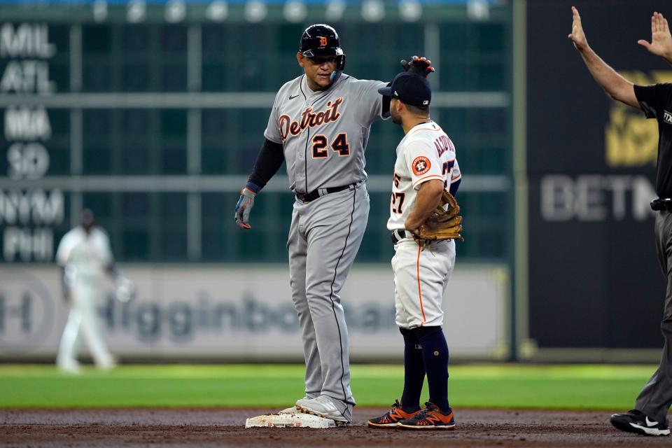 Tigers' Miguel Cabrera taps Houston Astros second baseman Jose Altuve (27) on the head after hitting a two-run double against the Astros during the third inning Saturday, May 7, 2022, in Houston. It was Cabrera's 600th career double.