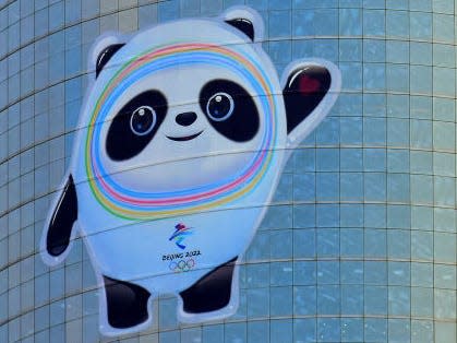 Bing Dwen Dwen and Shuey Rhon Rhon, mascots of the Beijing 2022 Winter Olympics and Paralympics displayed on a building in Beijing, China.