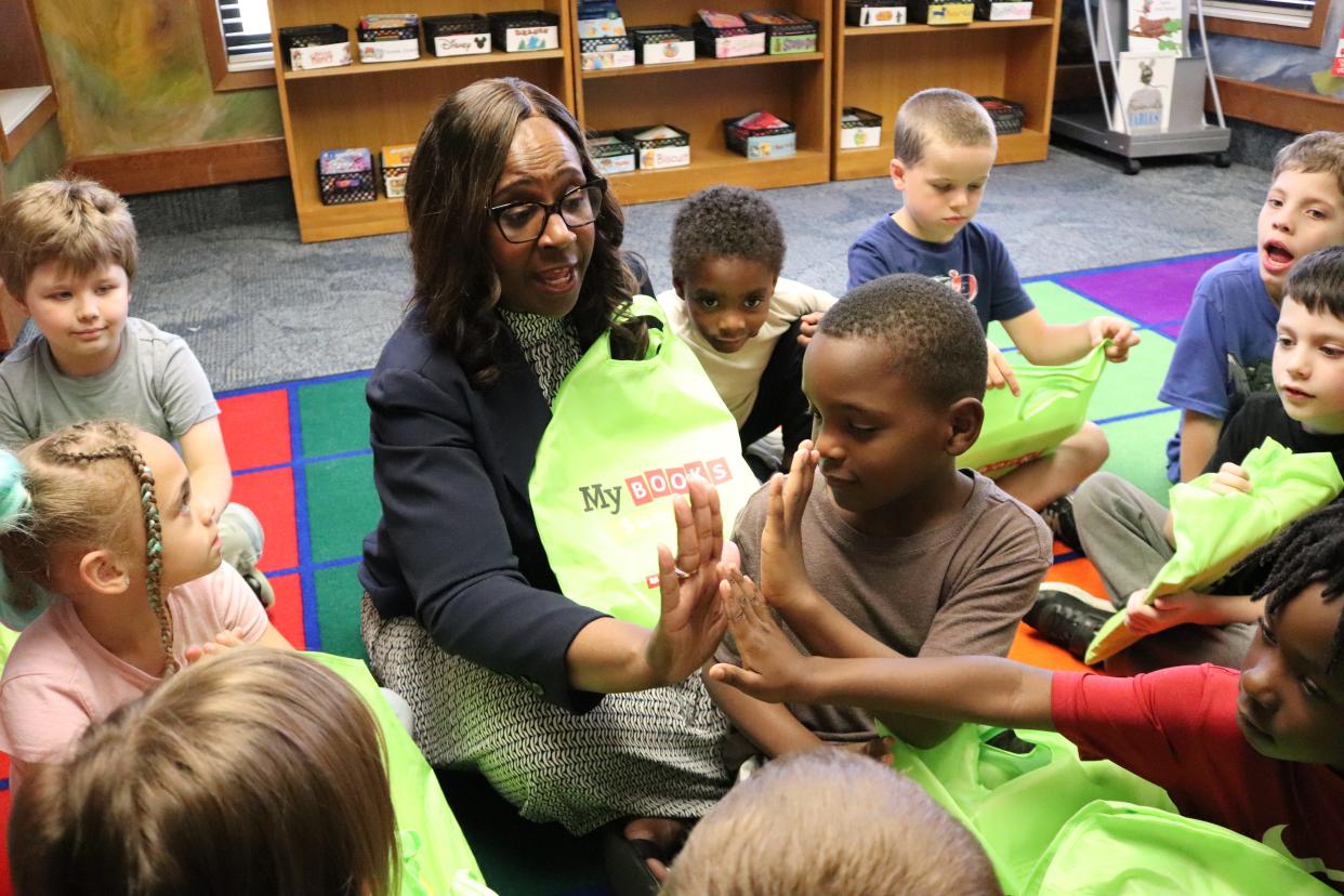 Superintendent Grenita Lathan distributed free books and educational magazines to students at Sunshine and Weaver elementary schools on May 13. It has become an end-of-year tradition for Lathan, an avid reader, as a way to encourage summer reading.