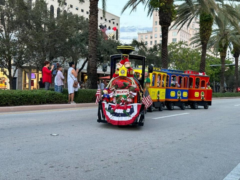 Florida Fun Train snakes around the Junior Orange Bowl 75 Parade route along Miracle Mile in Coral Gables on Dec. 10, 2023.