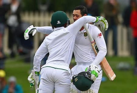 Cricket - Australia v South Africa - Second Test cricket match - Bellerive Oval, Hobart, Australia - 14/11/16 South Africa's Quinton de Kock hugs team mate Temba Bavuma as he celebrates reaching his century. REUTERS/David Gray